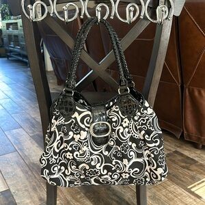 Brighton black-and-white shoulder purse with magnetic closure